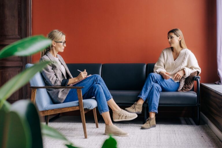 Thrive Mind & Wellness Center | ADHD Evaluations | A therapist speaks with her patient one on one.