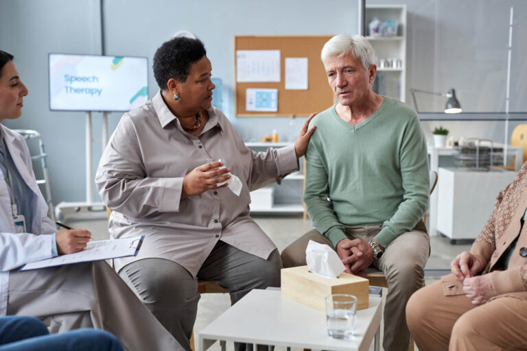 Thrive Mind & Wellness Center | Portrait of senior white haired man sharing feelings in mental health support group at retirement home