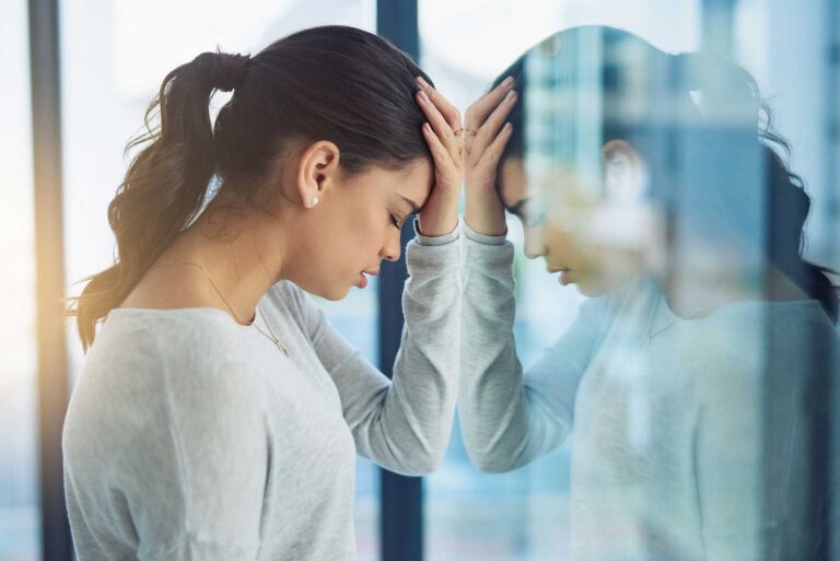 Thrive Mind & Wellness Center | Young business woman looking stressed.